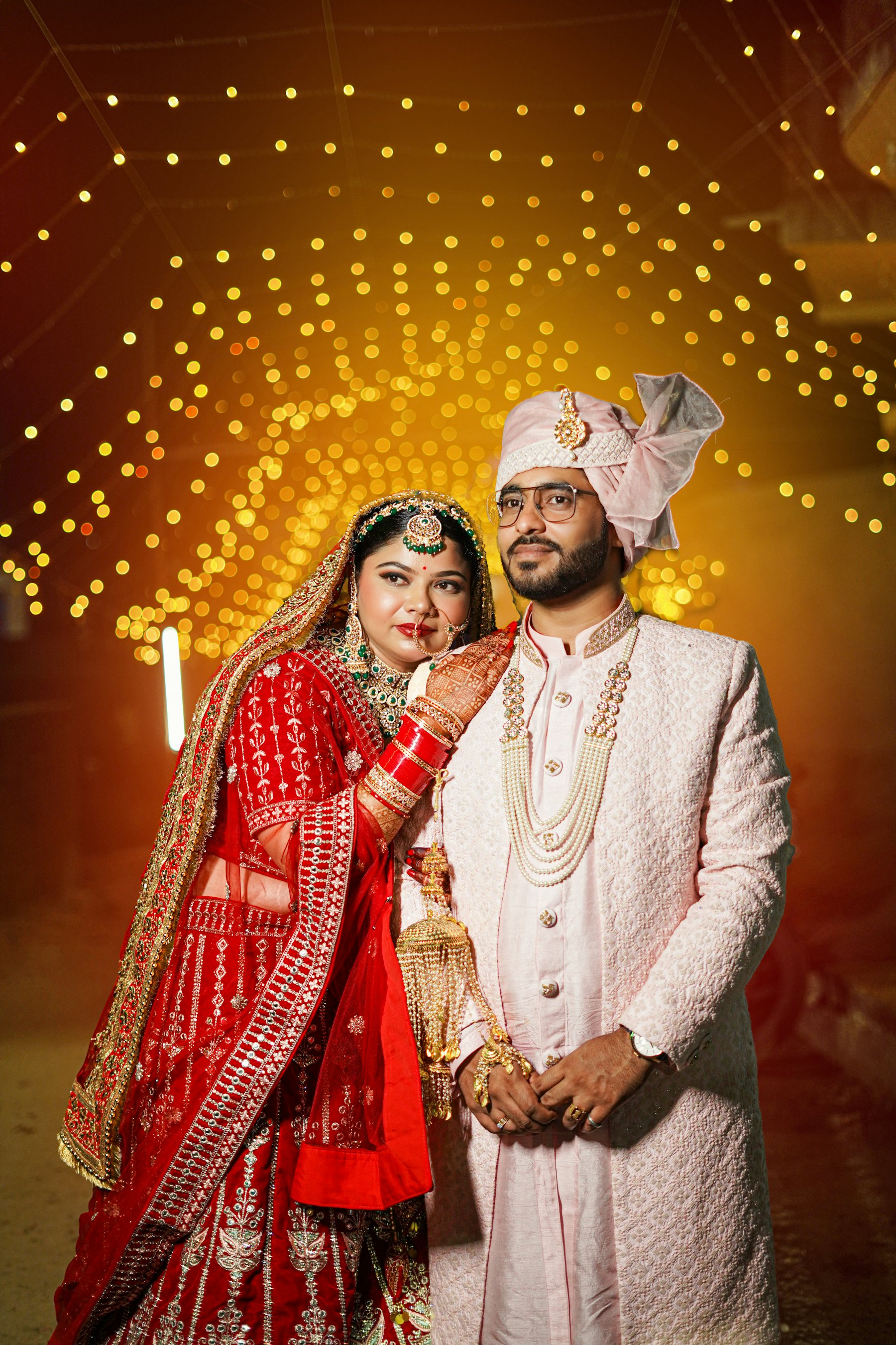 A couple celebrating, dressed in couture