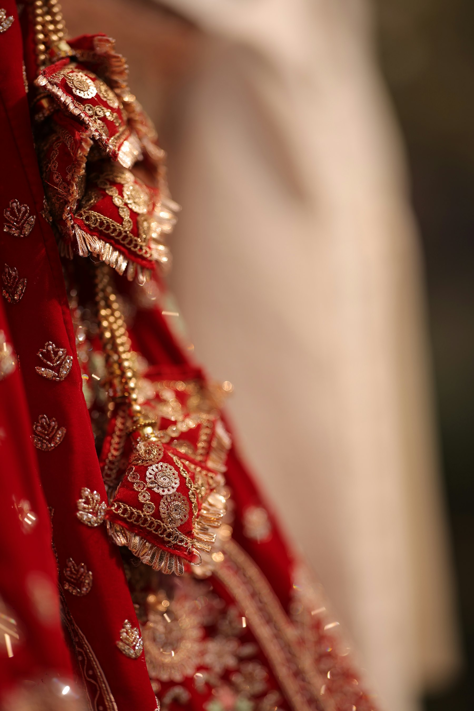 Bridal couture — red and gold detail